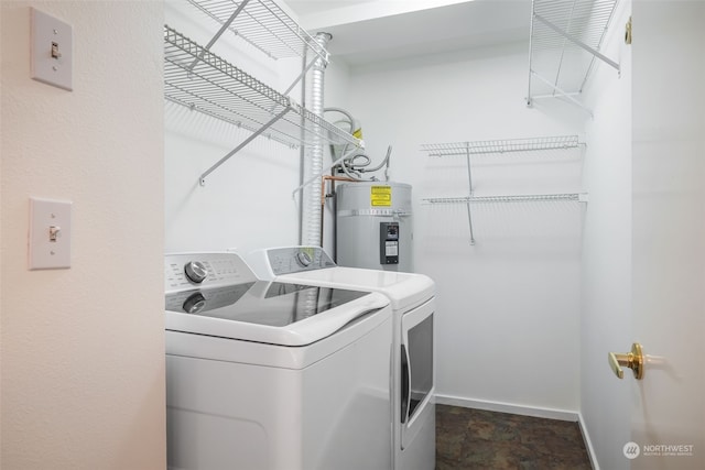 laundry room featuring electric water heater and washer and dryer