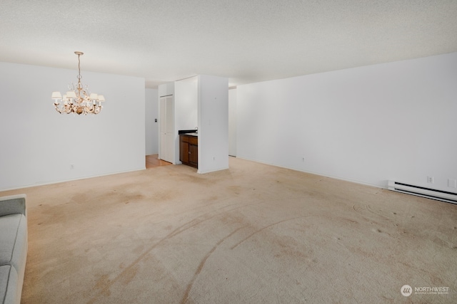 unfurnished living room with a textured ceiling, light colored carpet, an inviting chandelier, and a baseboard heating unit