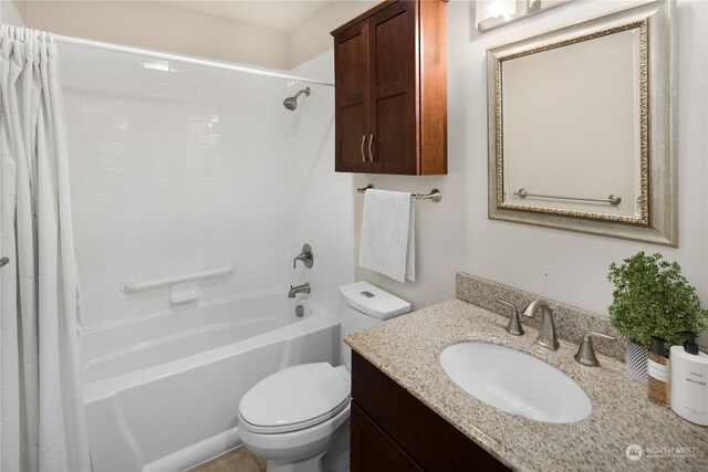 full bathroom with shower / tub combo, vanity, and toilet