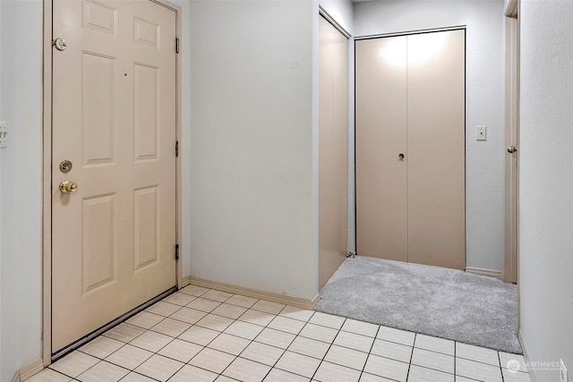 view of carpeted foyer