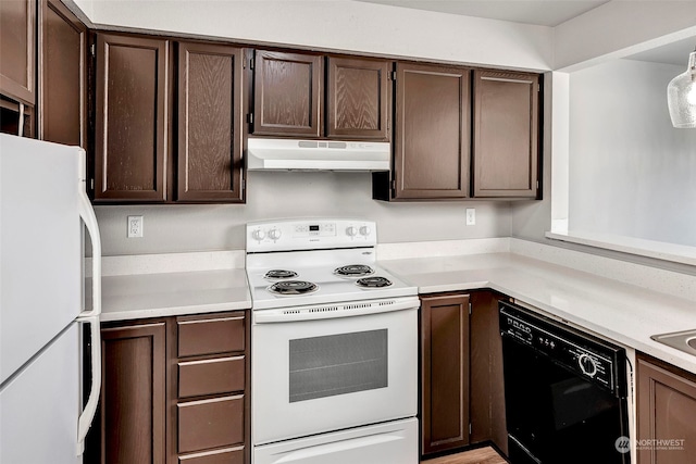 kitchen featuring dark brown cabinets and white appliances