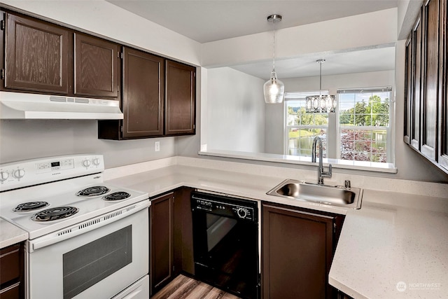 kitchen with pendant lighting, sink, electric range, black dishwasher, and a chandelier