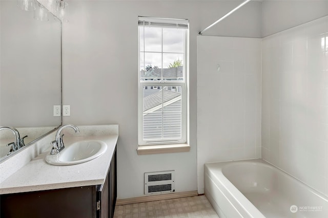 bathroom with vanity and bathtub / shower combination