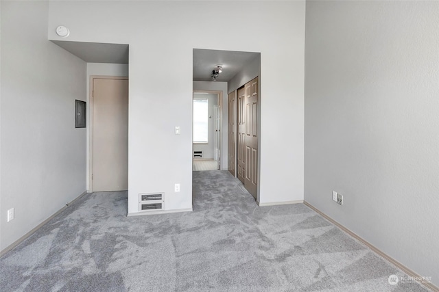 unfurnished bedroom featuring light carpet