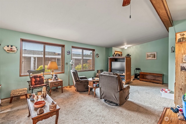 living room featuring carpet, beam ceiling, and ceiling fan