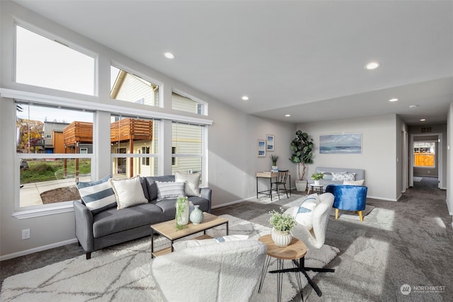 carpeted living room featuring lofted ceiling