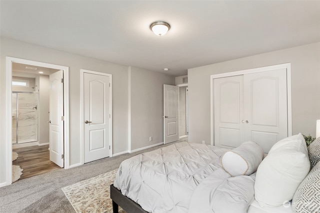 bedroom featuring light carpet and connected bathroom