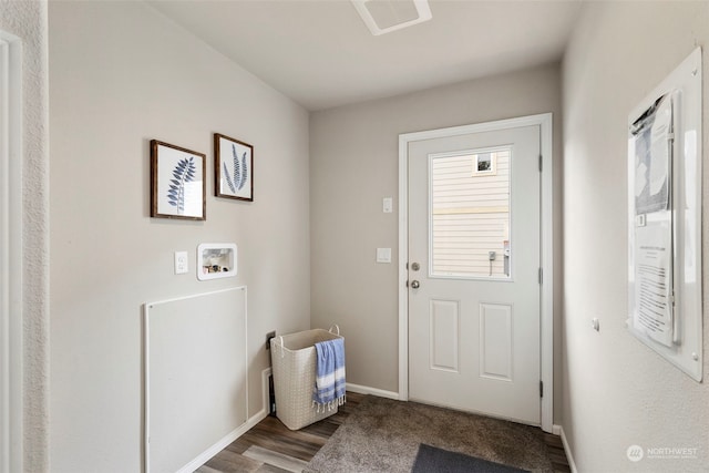 doorway to outside featuring hardwood / wood-style flooring