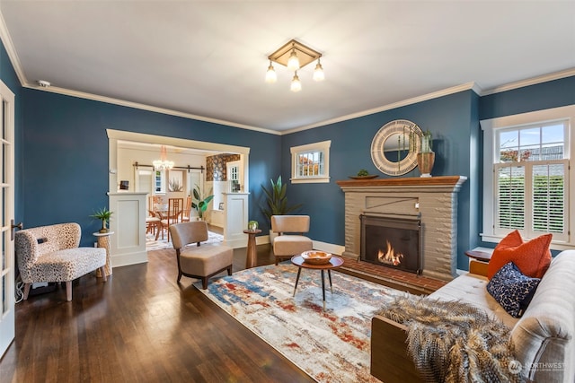 2033 11th Ave E, Seattle, WA 98102 - living area featuring wood finished floors, a fireplace, ornamental molding, and a chandelier