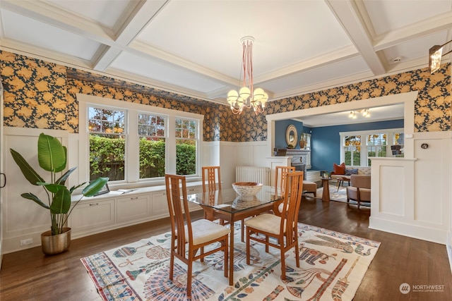 dining room featuring coffered ceiling, dark hardwood / wood-style floors, and plenty of natural light