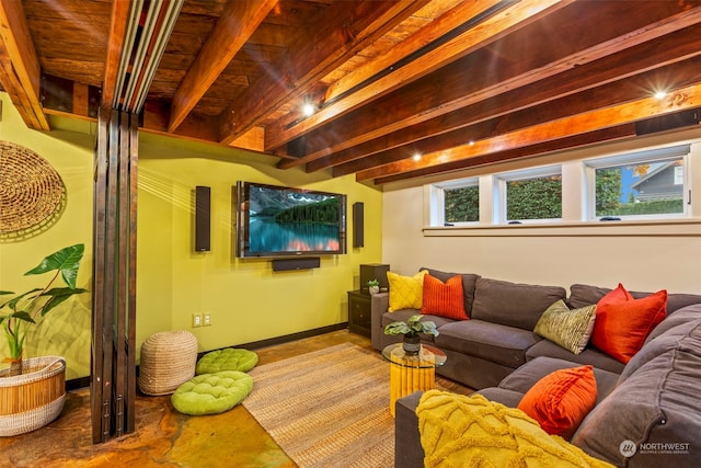 home theater featuring plenty of natural light and beamed ceiling