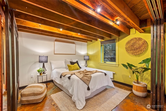 2033 11th Ave E, Seattle, WA 98102 - bedroom featuring beam ceiling, radiator, baseboards, and concrete flooring