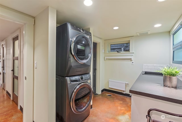 2033 11th Ave E, Seattle, WA 98102 - laundry room featuring estacked washer and dryer and recessed lighting