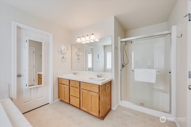 bathroom featuring walk in shower and vanity