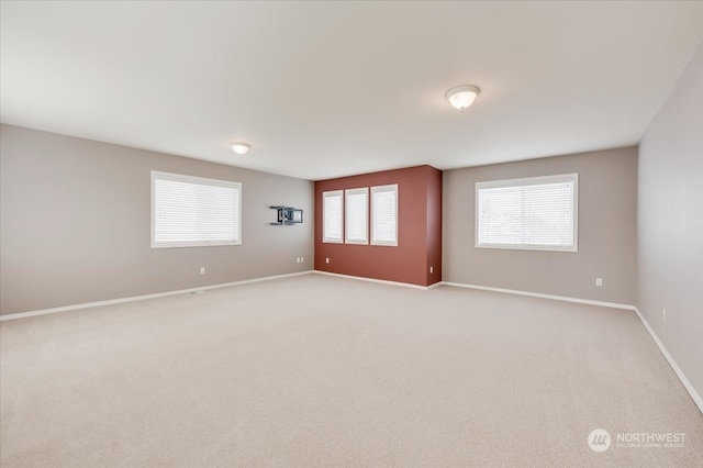 empty room with light colored carpet