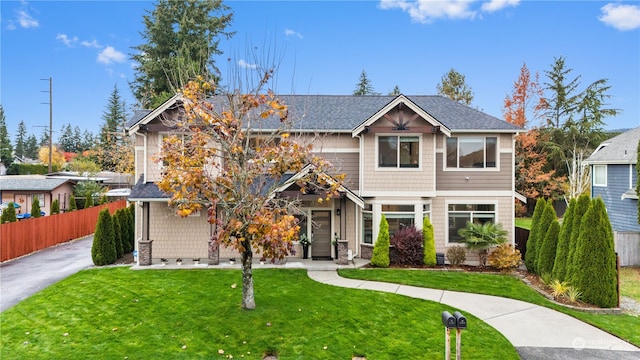 craftsman-style home featuring a front yard