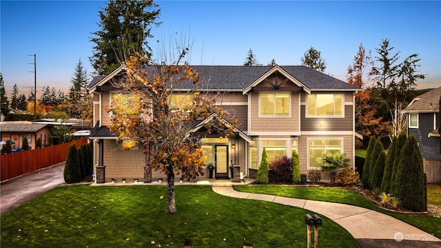 craftsman house featuring a yard