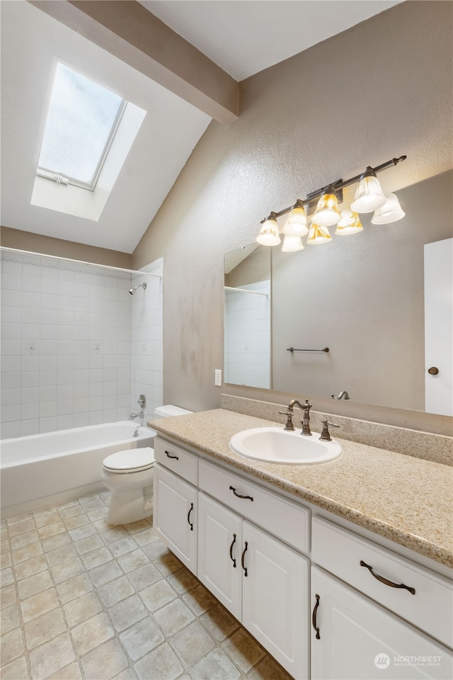 full bath featuring lofted ceiling with skylight, bathing tub / shower combination, toilet, and vanity