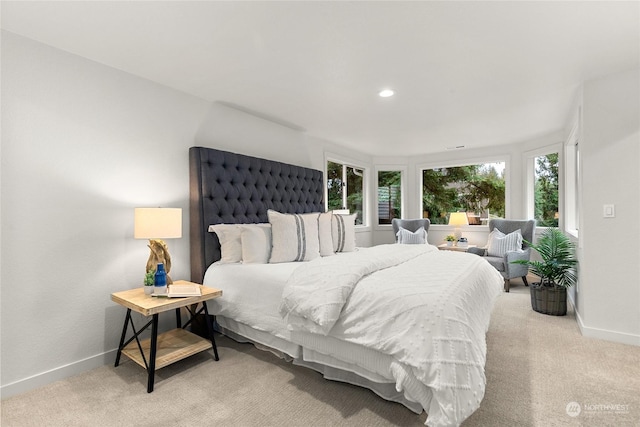 bedroom featuring light colored carpet