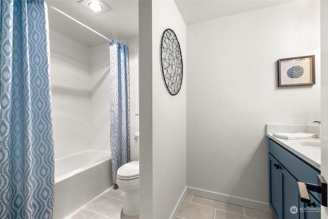 full bathroom with tile patterned flooring, vanity, shower / tub combo, and toilet