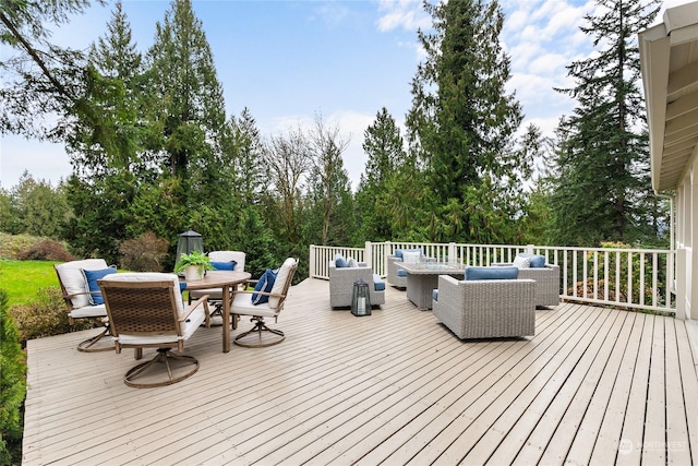 wooden terrace with outdoor lounge area