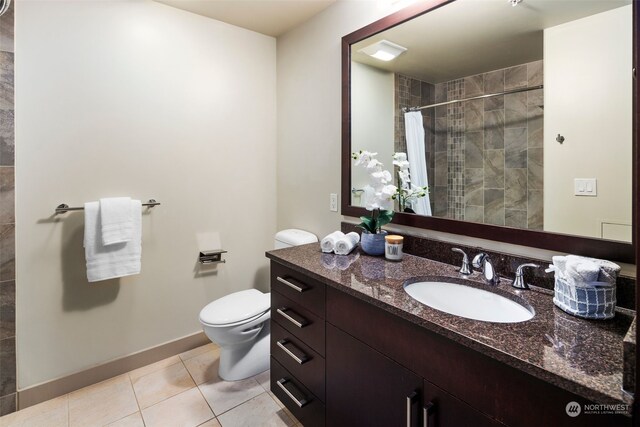 bathroom with toilet, vanity, tile patterned floors, and a shower with shower curtain