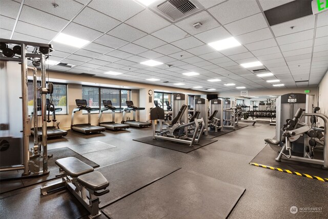 exercise room with a drop ceiling