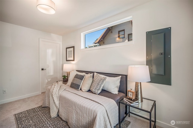 bedroom featuring electric panel and carpet