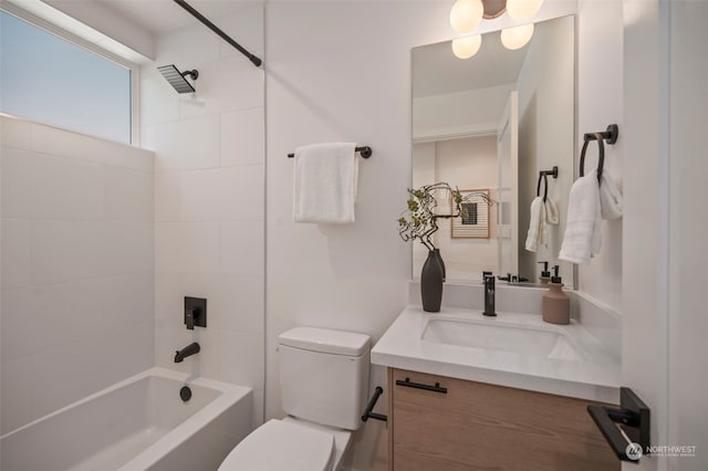 full bathroom featuring vanity, toilet, and tiled shower / bath