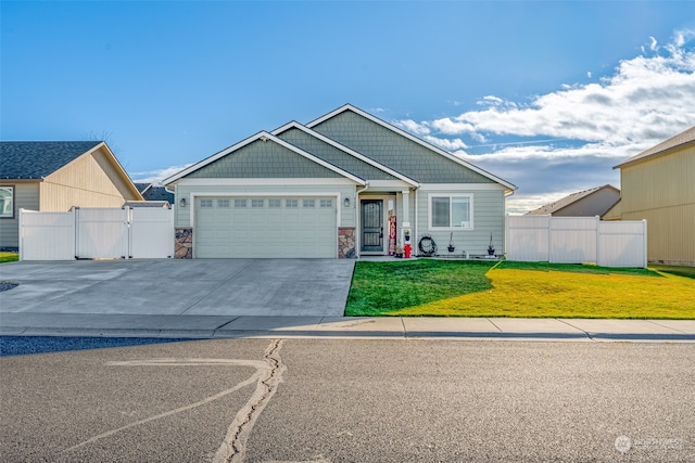 view of front of home featuring a garage and a front lawn