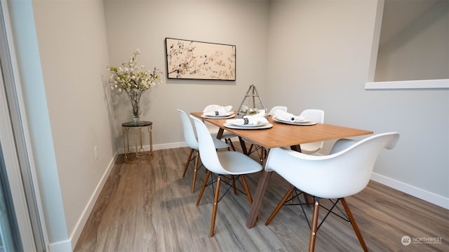 dining area featuring hardwood / wood-style floors