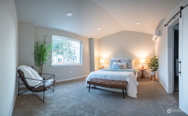 carpeted bedroom featuring vaulted ceiling and a barn door