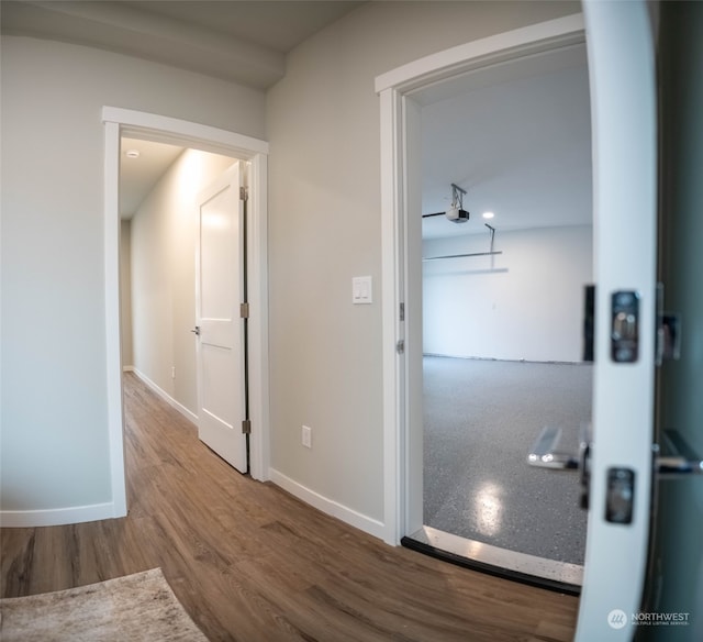 hallway featuring wood-type flooring