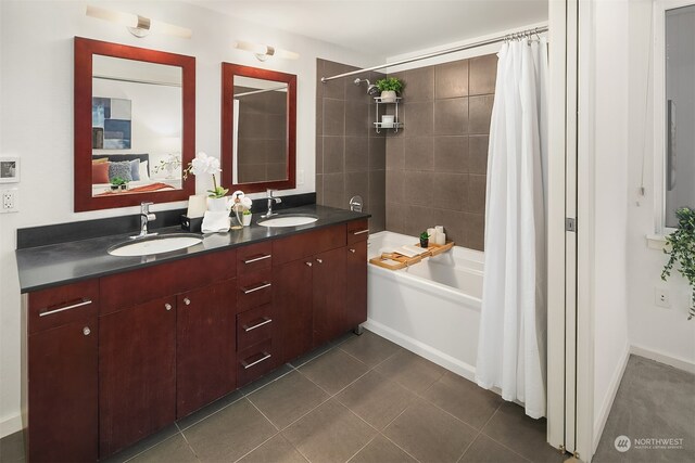 bathroom featuring vanity, tile patterned flooring, and shower / bathtub combination with curtain