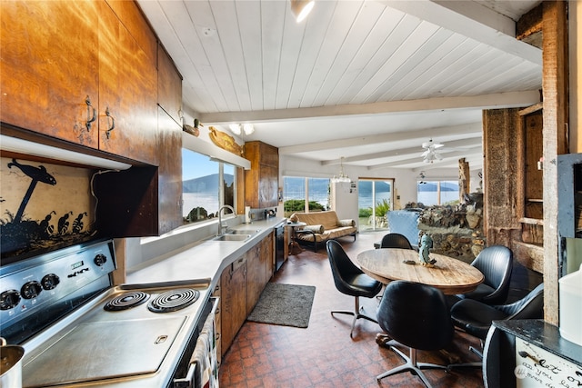 kitchen with stainless steel electric range oven, sink, ceiling fan, and vaulted ceiling with beams