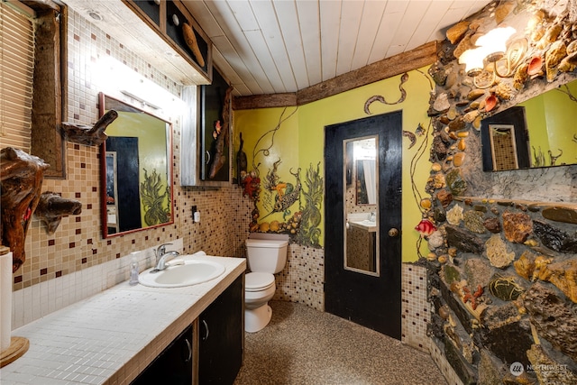 bathroom featuring decorative backsplash, vanity, toilet, and wooden ceiling