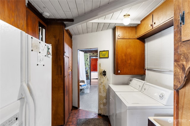 laundry room with cabinets and washer and dryer