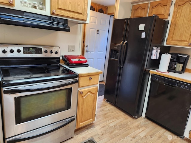 kitchen featuring black appliances, range hood, and light wood-type flooring