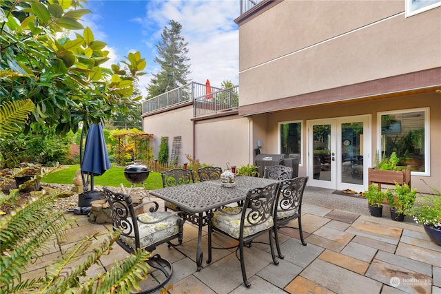 view of patio featuring outdoor dining space and french doors