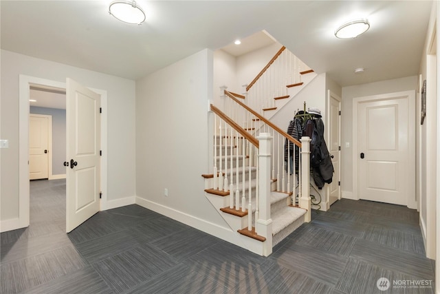 staircase with carpet and baseboards