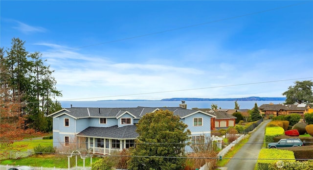 exterior space with a fenced front yard and a mountain view