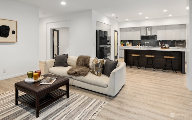 living room with light hardwood / wood-style flooring