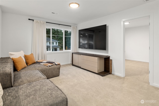 living room featuring light carpet