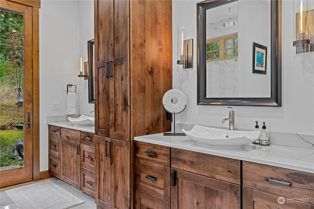 bathroom with vanity and a healthy amount of sunlight