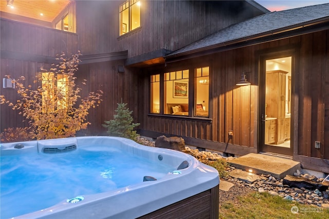 exterior space featuring a hot tub