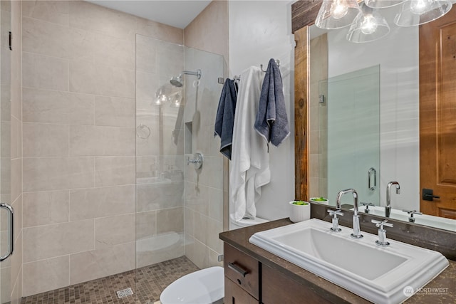 bathroom with vanity and a shower with door