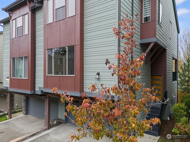 view of side of property with a garage