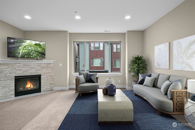 carpeted living room featuring a stone fireplace