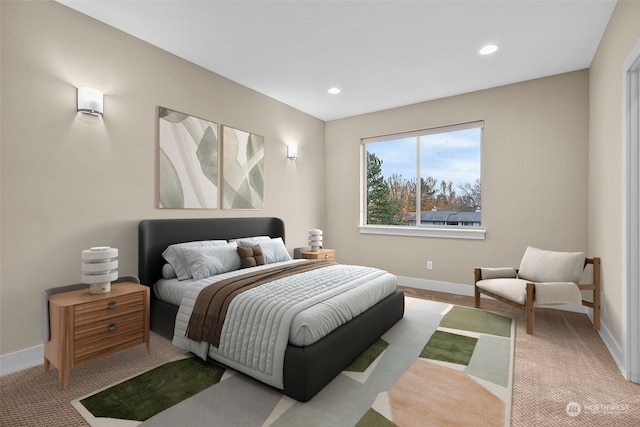 bedroom featuring light colored carpet