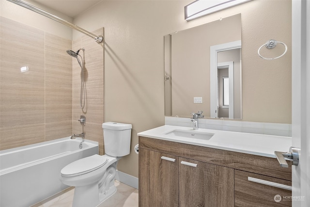 full bathroom with tile patterned flooring, vanity, tiled shower / bath combo, and toilet